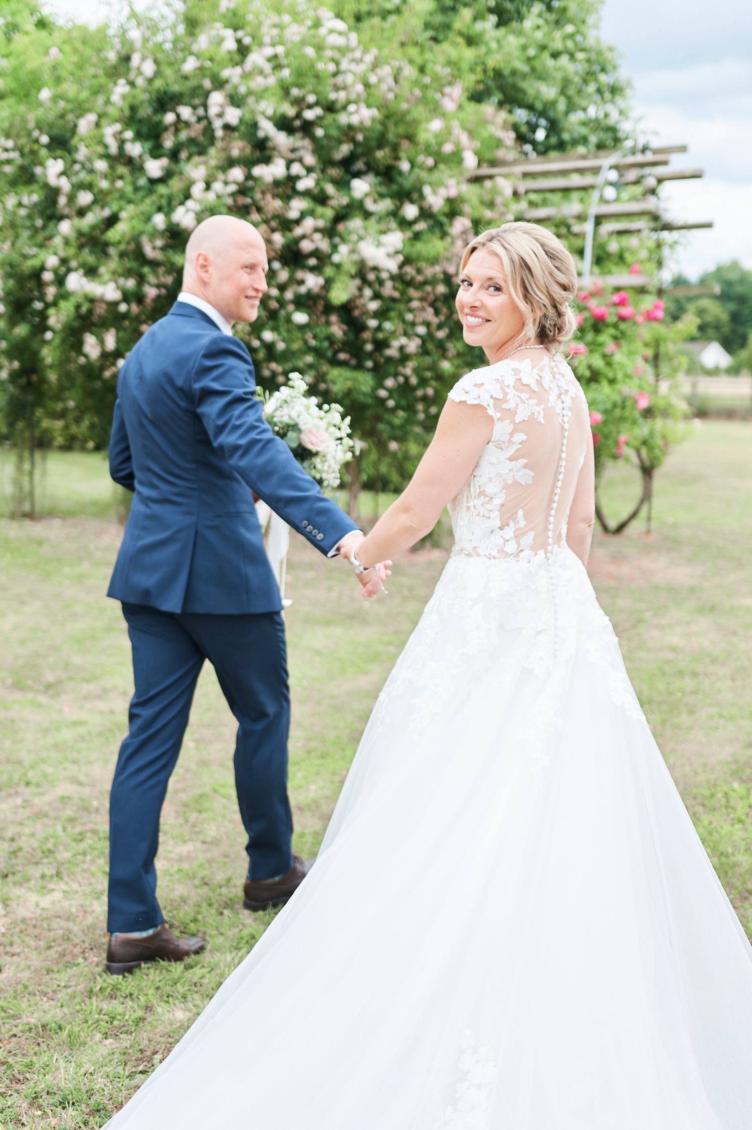 bride and groom portraits in gardens at luxury Reymerston wedding. by Norfolk's best wedding photographer Faye Amare