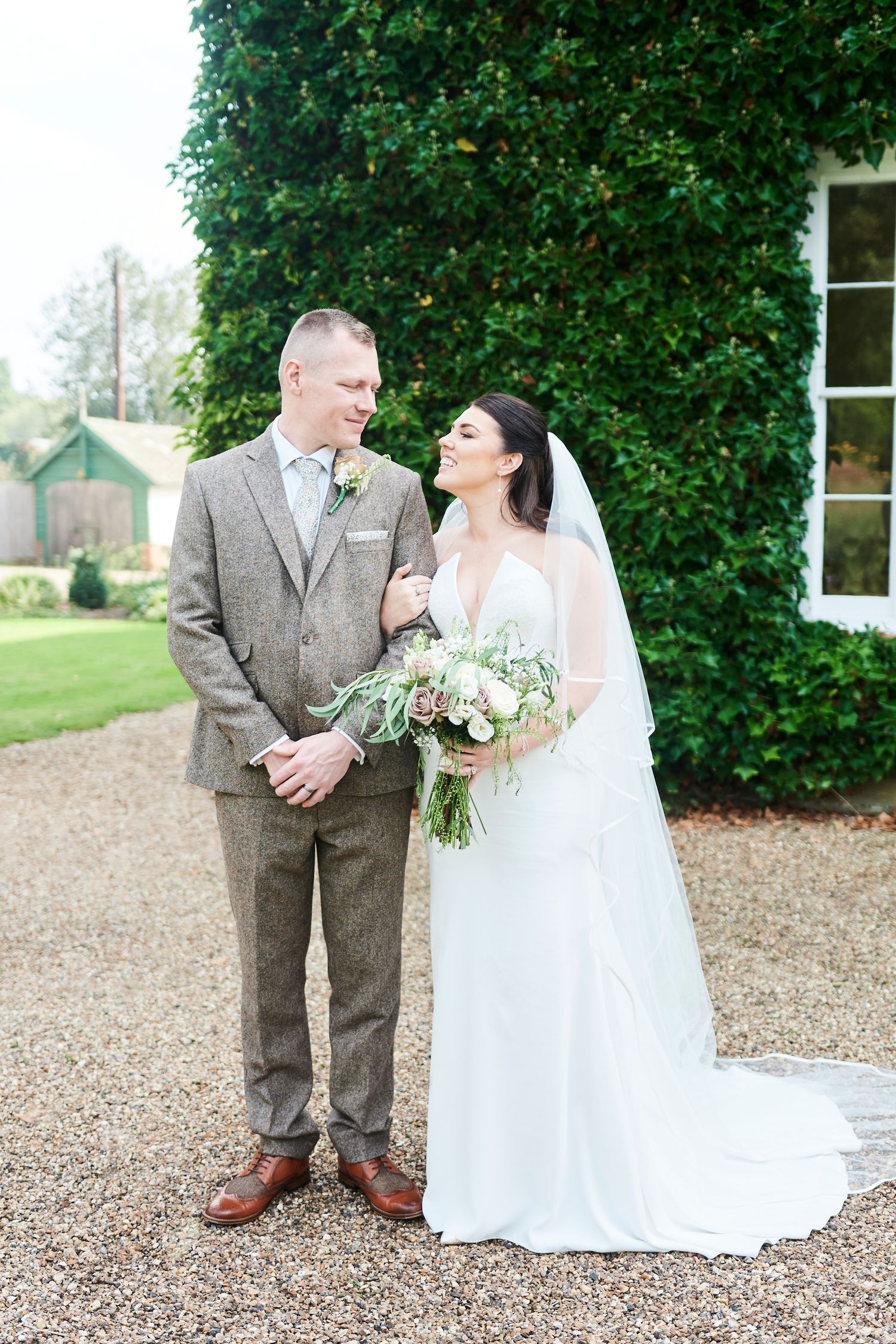 bride & groom portrait in gardens at luxury Bressingham Hall wedding by Norfolk's best wedding photographer Faye Amare