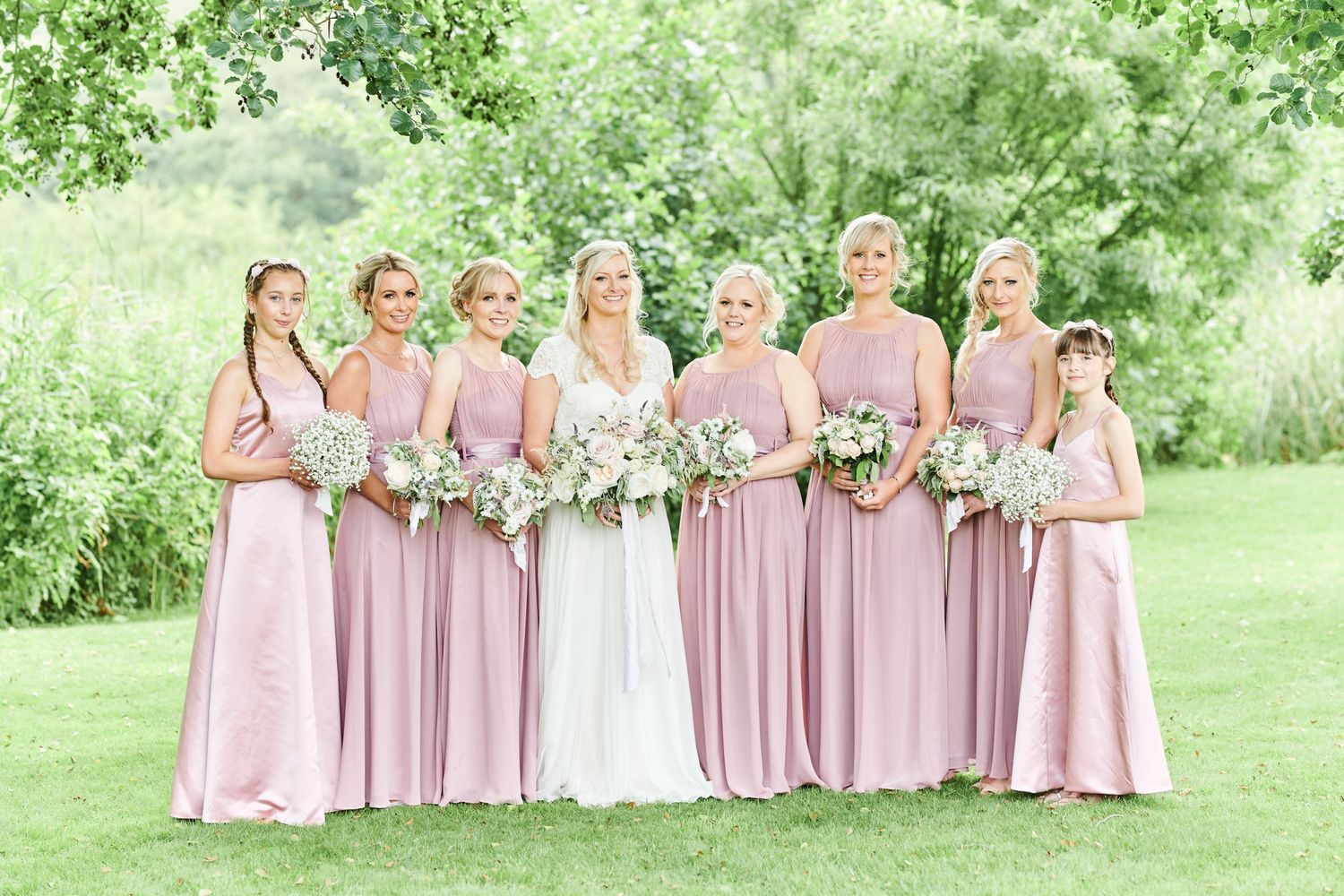 stunning group portrait of bridal party at The Boathouse, Ormesby. by Norfolks best wedding photographer Faye Amare