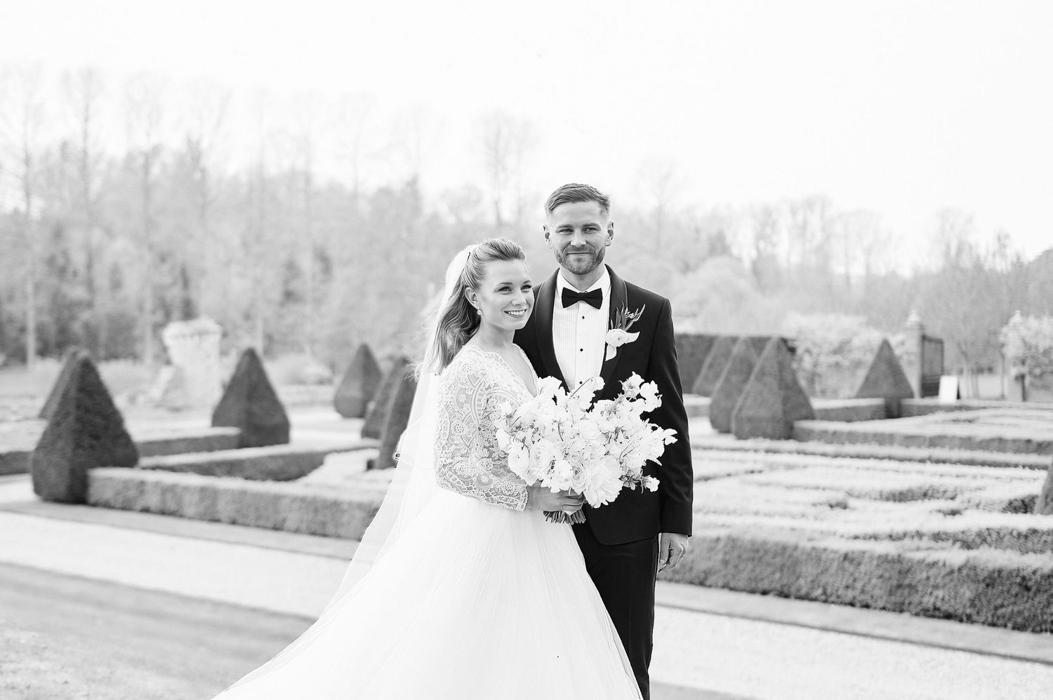 bride & groom portraits in the gardens of Norfolk's luxury Oxnead Hall by Norwich's best wedding photographer Faye Amare